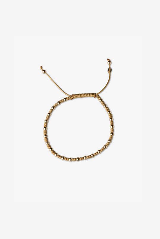 Pulseira às bolinhas em ouro amarelo com algodão bege