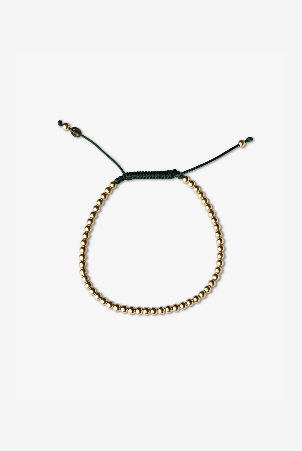 Pulseira em ouro com bolinhas e algodão verde