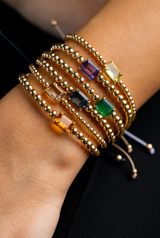 Pulseira em ouro amarelo com topázio azul.