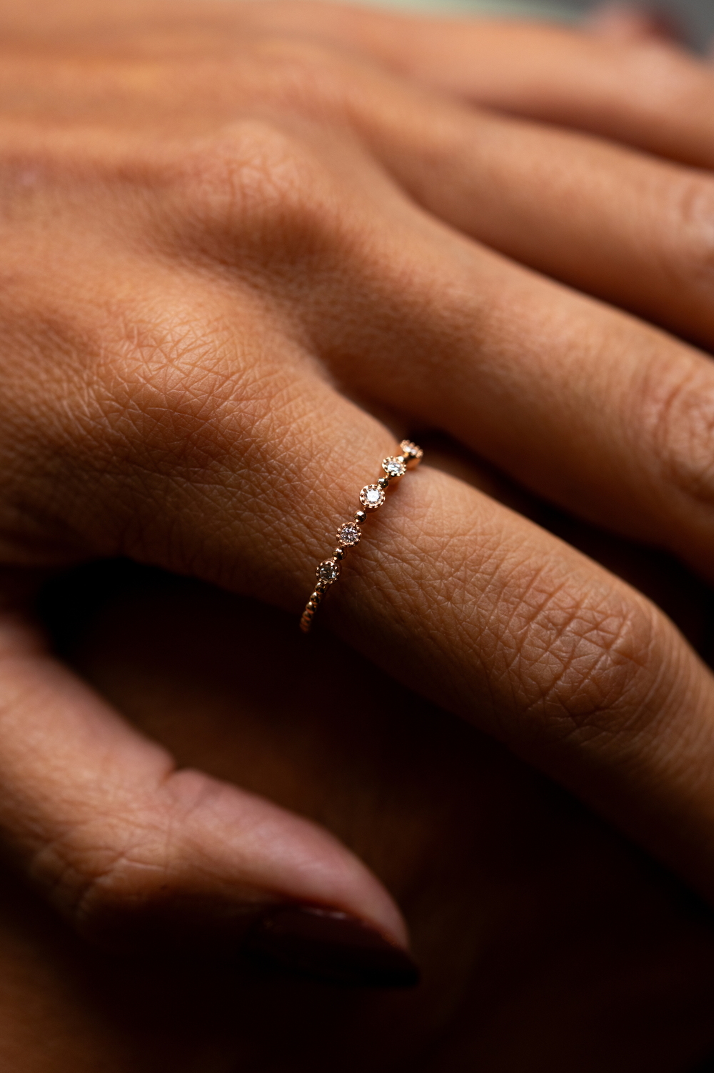 Anel em ouro rosa com 5 diamantes